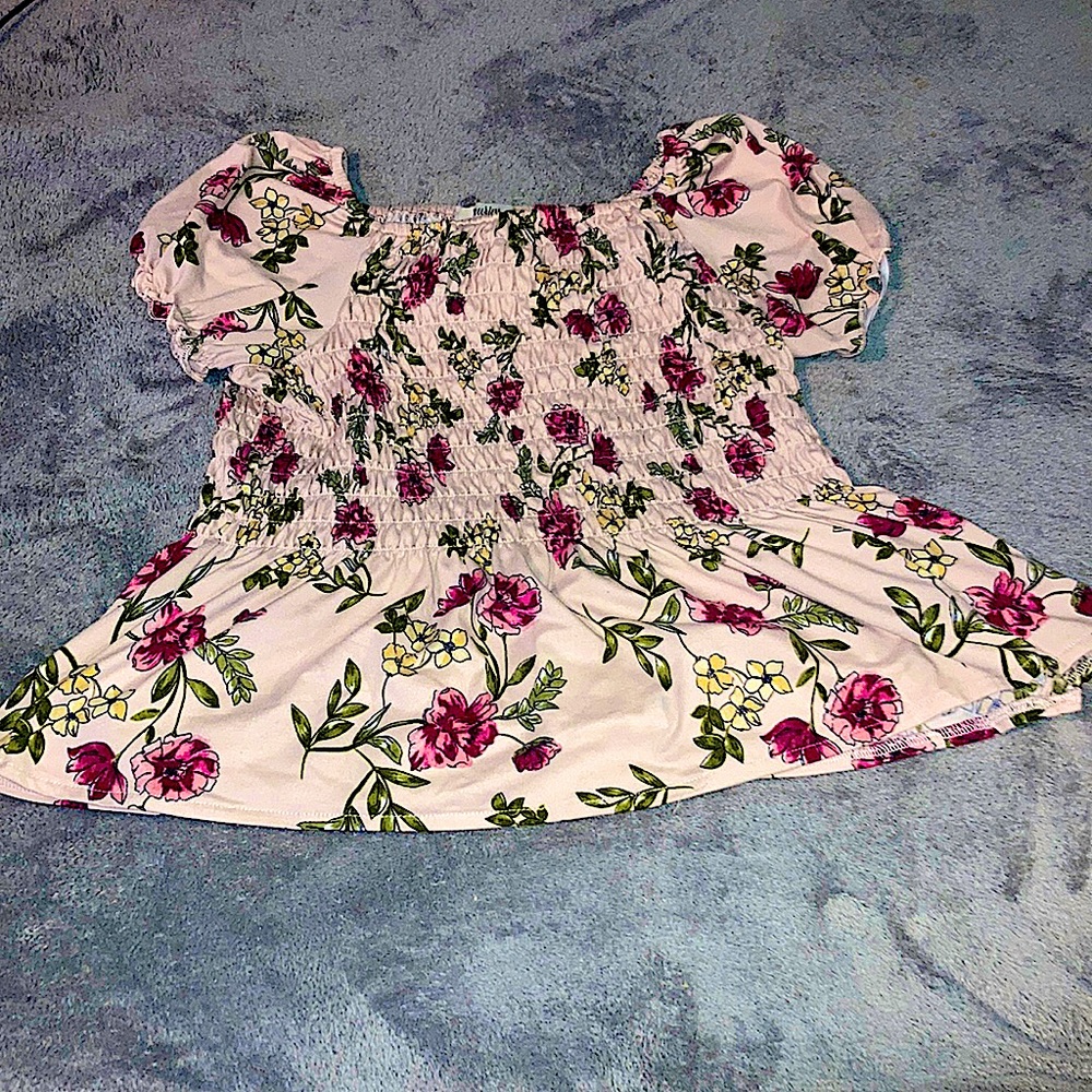 Pink flowered shirt slightly of on right sleeve can be easily fixed